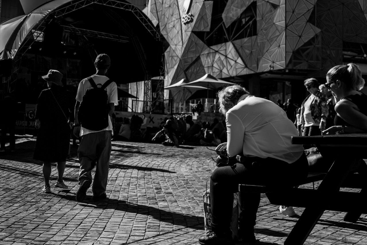 people milling about in federation square melbourne